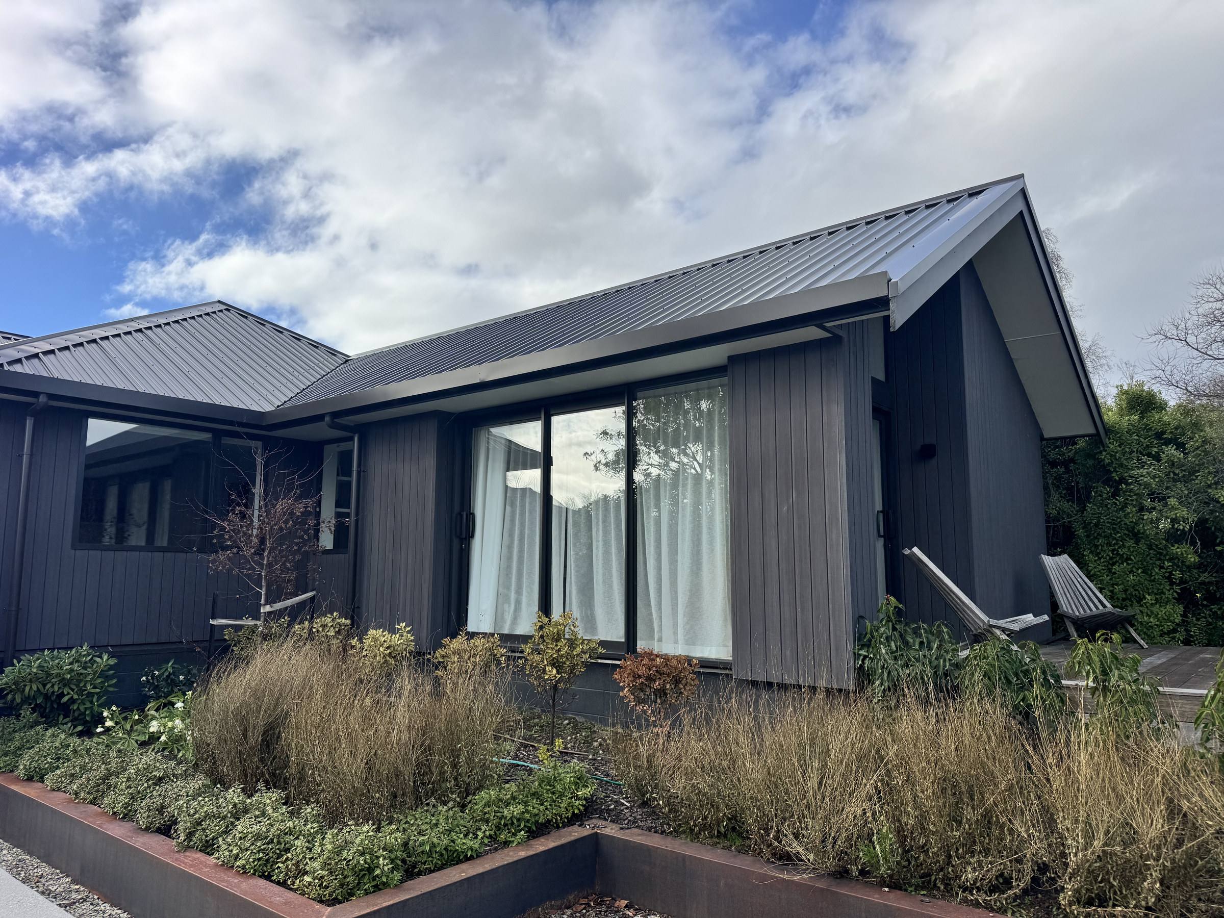 Dark-stained cedar cladding on a Wānaka home